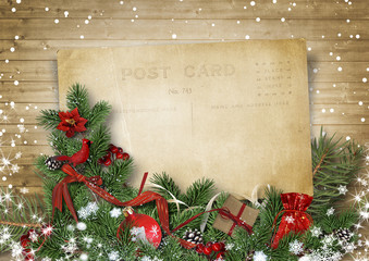 Vintage Christmas background with old postcard and firtree
