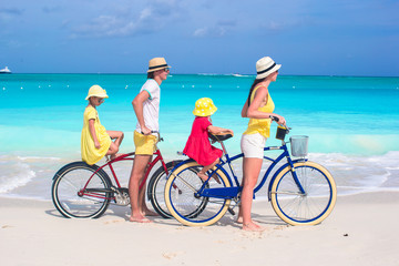 Fototapeta premium Family of four with two kids during beach summer vacation