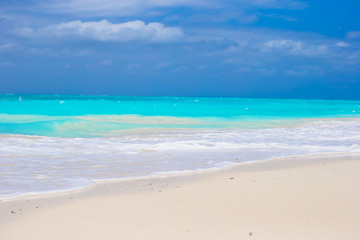White sandy beach with turquoise water at perfect island