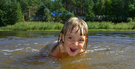 Little girl in water on sunny day