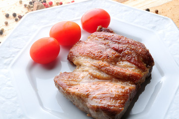 pork steak with cherry tomatos