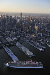 Cruise ship with Manhattan skyline along Hudson river, New York