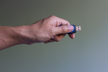 Fototapeta premium Hand holding flash drive