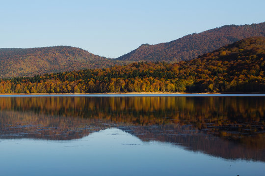 Autumn mirror reflection in lake Pasanauri, Georgia © ellemarien7