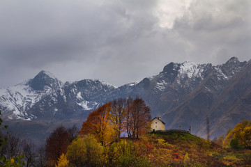 Church on top of autumn hill in village Georgia
