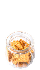 Sugar crackers or biscuits in a cookie jar over white background