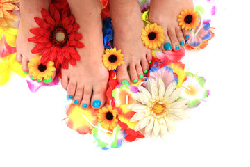 women feet (pedicure)  with flowers