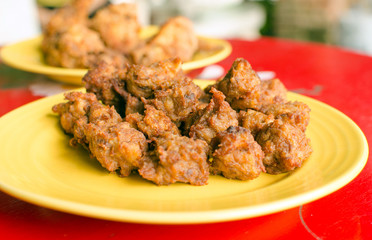 Fried chicken on a yellow plate