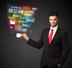 Businessman holding a white cup with daily news and information
