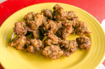 Fried chicken on a yellow plate