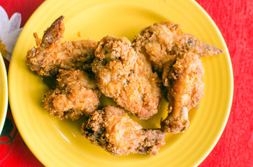 Fried chicken on a yellow plate