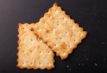 cookies crackers and crumbs on a dark background