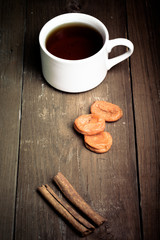 cup of tea on an old wooden table. small depth of field