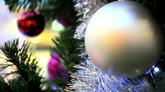 Christmas scene with tree and colordul balls, close-up. HD.