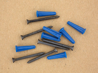 Group of screws with plastic anchors