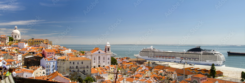 Wall mural view of a big cruise ship docked in lisbon, portugal.