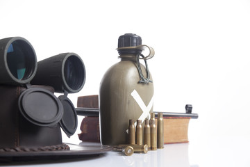 military set with helmet, binoculars and water canteen 