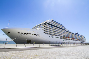 View of a huge cruise ship docked in Lisbon, Portugal. - obrazy, fototapety, plakaty