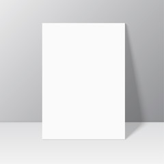 White blank stationary near the wall with shadow.