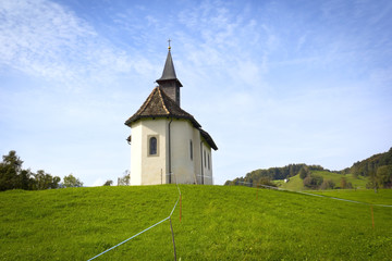 Fototapeta na wymiar Little chapel in the Alps, Switzerland