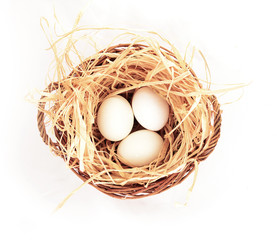 three eggs in basket on white background . .Find Similar Images.