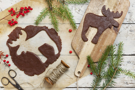 homemade gingerbread elk shaped cookie for Christmas on table