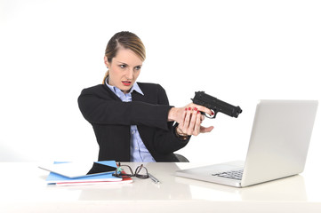 businesswoman pointing gun to computer desperate and stressed
