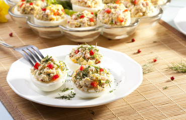 stuffed eggs with ham, red pepper and dill