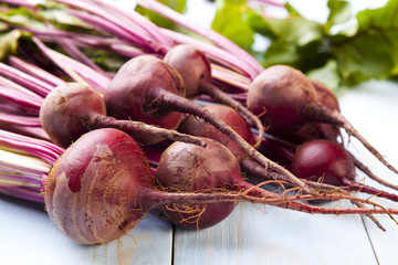 Fresh beets on a wooden board