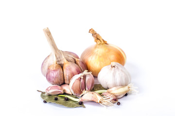 onions and garlic on a bay leaf