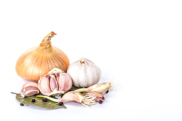 onions and garlic on a bay leaf