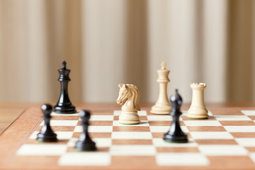 Chess pieces set on a chessboard