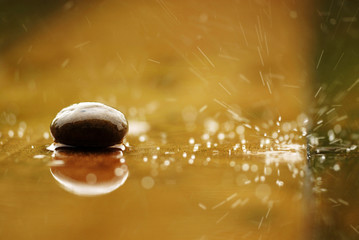 stone stan on reflexing ground in the raining day