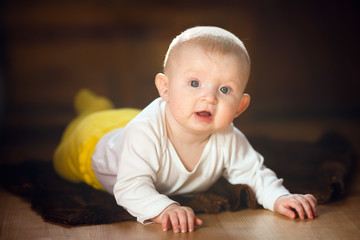 6-month-old baby lying on the floor