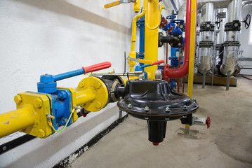 Place in a large industrial boiler room.