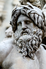 Face of Zeus in Piazza Navona fountain, Rome Italy