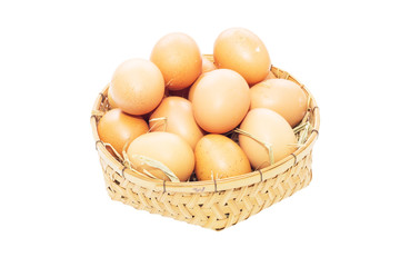eggs in basket isolated on white background