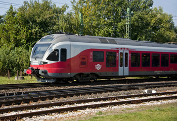 Obraz premium Commuter train approaches the train station.