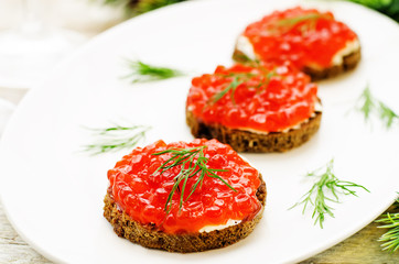 canape with red caviar and cream cheese