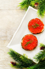 canape with red caviar and cream cheese