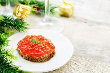 canape with red caviar and cream cheese
