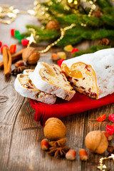 Fototapeta premium Christmas Stollen. Traditional Sweet Fruit Loaf with Icing Sugar