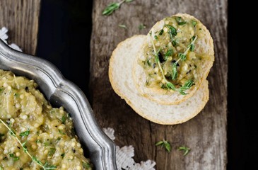 Meze Mutabbal - Arabian snack from eggplant in vintage iron plate on wooden background