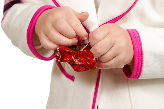 Hands Unwrapping Candy