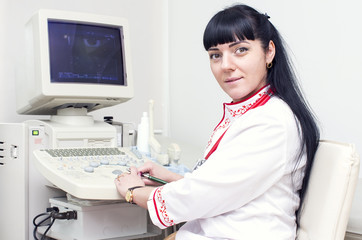 Doctor woman in the office of ultrasound