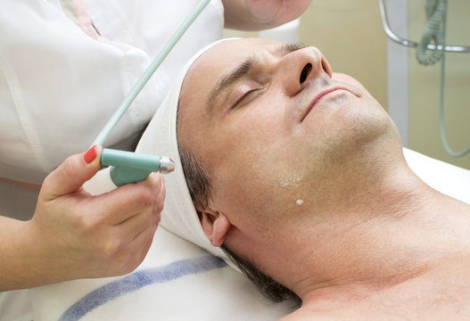 man in a beauty salon facial and massage