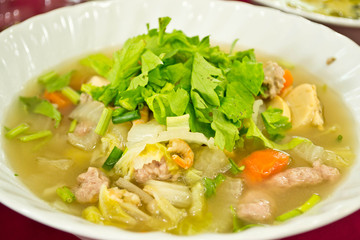 A bowl of hot Broth or Vegetable Soup