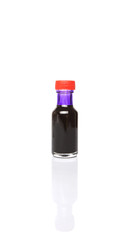 Liquid purple food color additive over white background