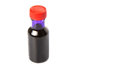 Liquid purple food color additive over white background