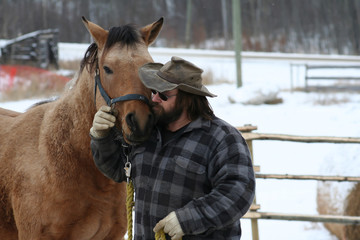 Man Kissing his Horse